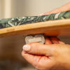 close up of the toggle fixings on an indoor cat tree platform