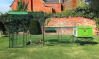 A new Eglu Cube chicken coop connected to a Walk in Chicken run
