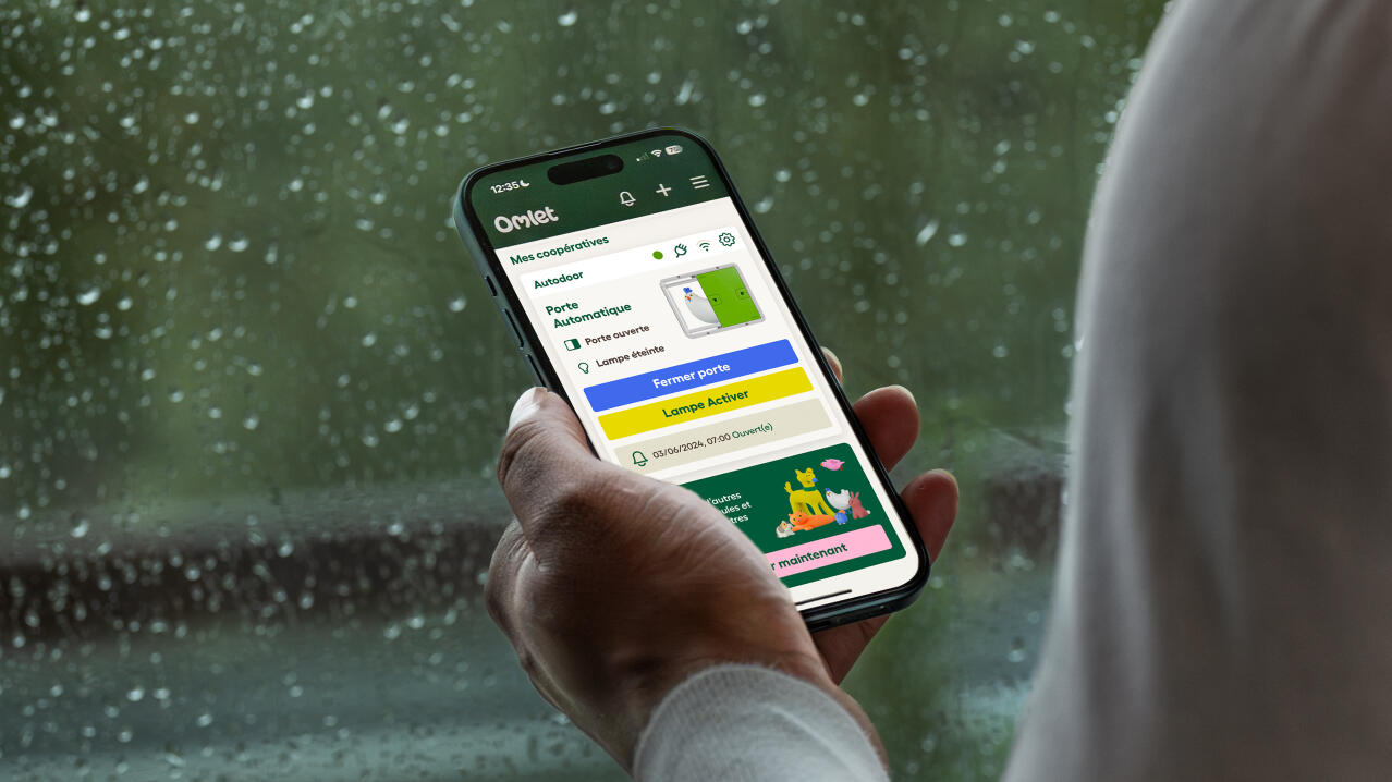 omlet app screen on a phone showing status of automatic door