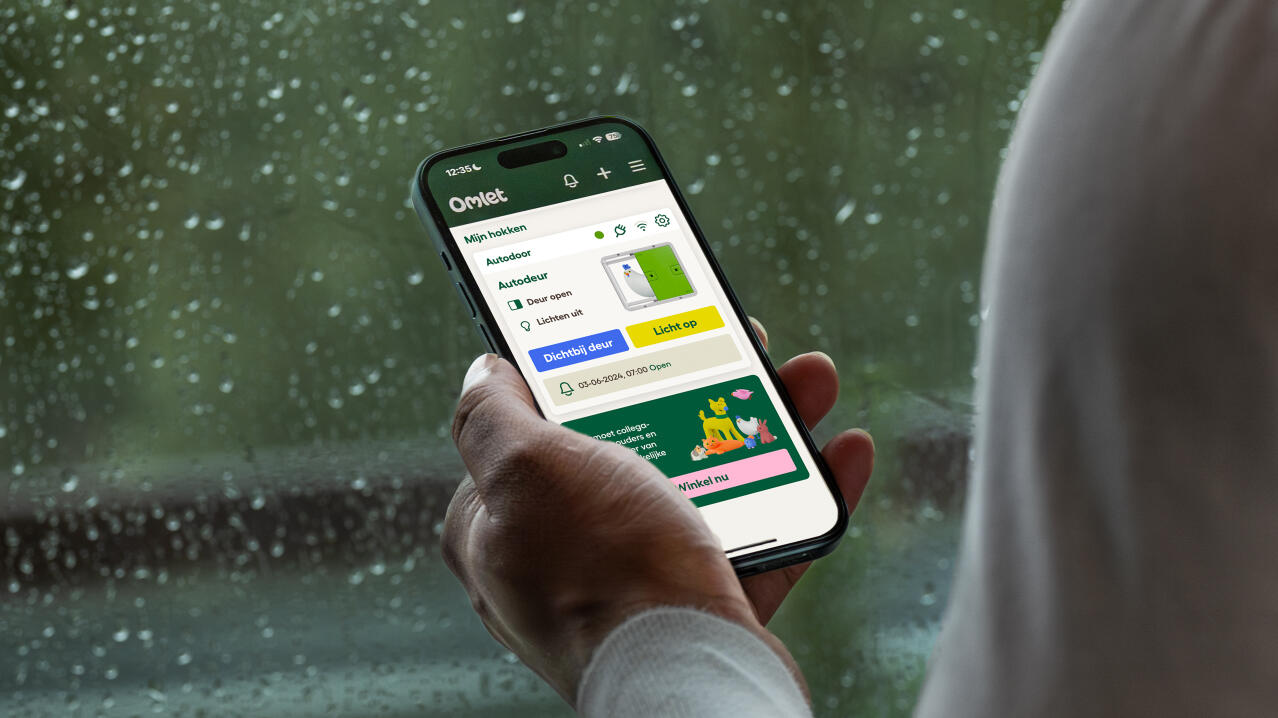 omlet app screen on a phone showing status of automatic door