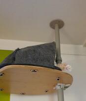 The bamboo platform with felt den and woven grey cushion