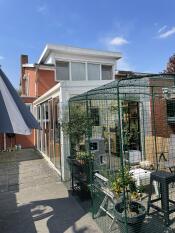 The Omlet outdoor cat run attached to a conservatory.