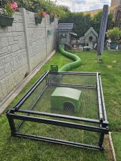 The Zippi tunnel connecting a hutch and a run set up in a garden.