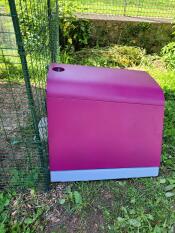 The purple Eglu Go chicken coop attached to a walk in run.