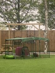 The 2 x 2 x 1 outdoor rabbit run set up with a Eglu Go hutch in a garden.