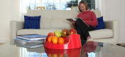 A red rollabowl fruit bowl in a home