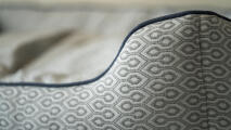 detail of a nest bed showing honeycomb slate print and bed piping