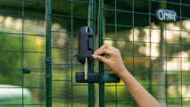 detail of a hand using the walk in run door lock