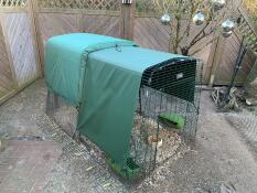 Eglu Cube Chicken Coop set up in garden with insulated Extreme Temperature Blanket and Heavy Duty Run Cover.