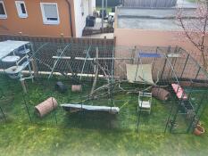 A birds eye view of the omlet outdoor cat run with freestyle cat tree and various accessories set up inside.