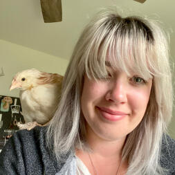 A chicken perching on my shoulder.