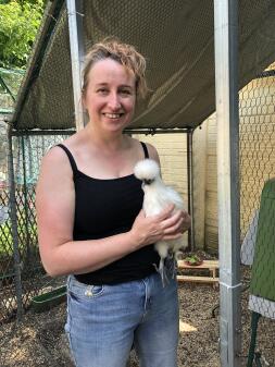 Chicken being held by lady