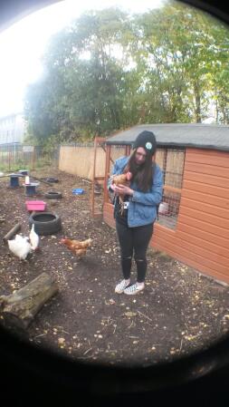 Holding the chickens in college.