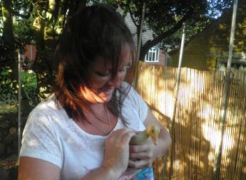 Holding our new duckling.