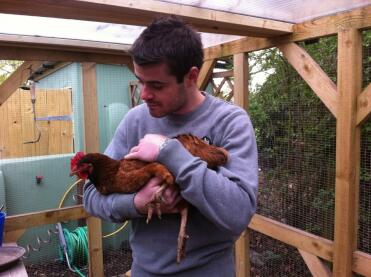 Man holding chicken