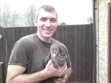 Steven field holding a speckled hen