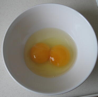 Double yolk in bowl