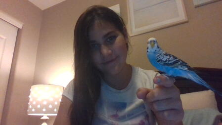 Girl Holding Parakeet