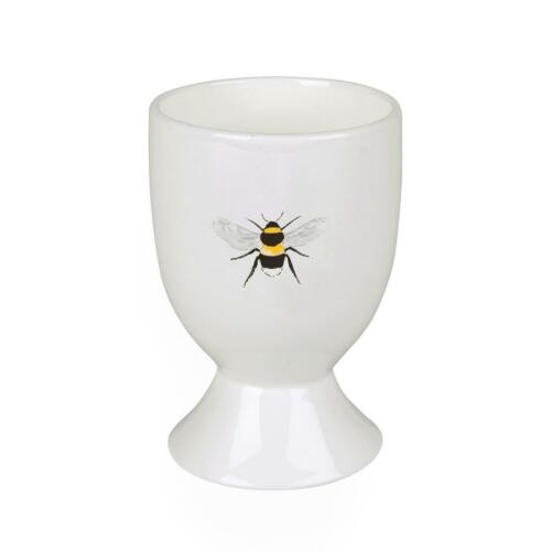 An eggcup with a bee on the front.