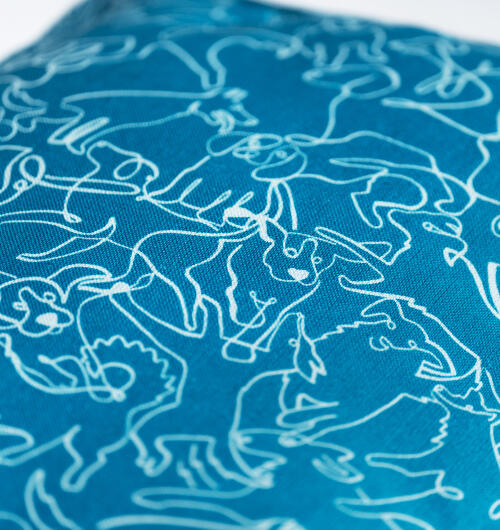 A close up of the Doodle Dog cushion dog bed