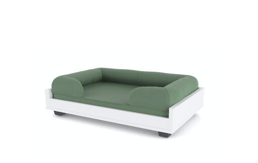 The Omlet green bolster bed with raised dog bed platform.
