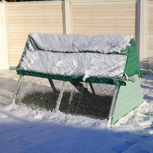 The Omlet wooden chicken coop in the snow.