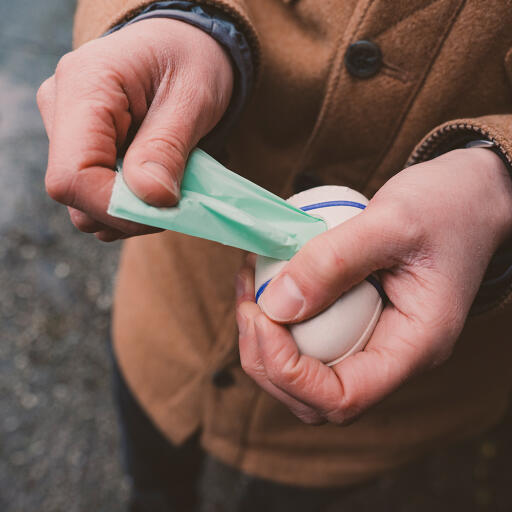 Pulling out dog poo bag