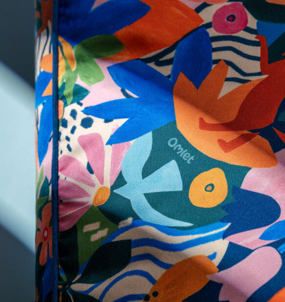 adventure land print close up on a cushion dog bed