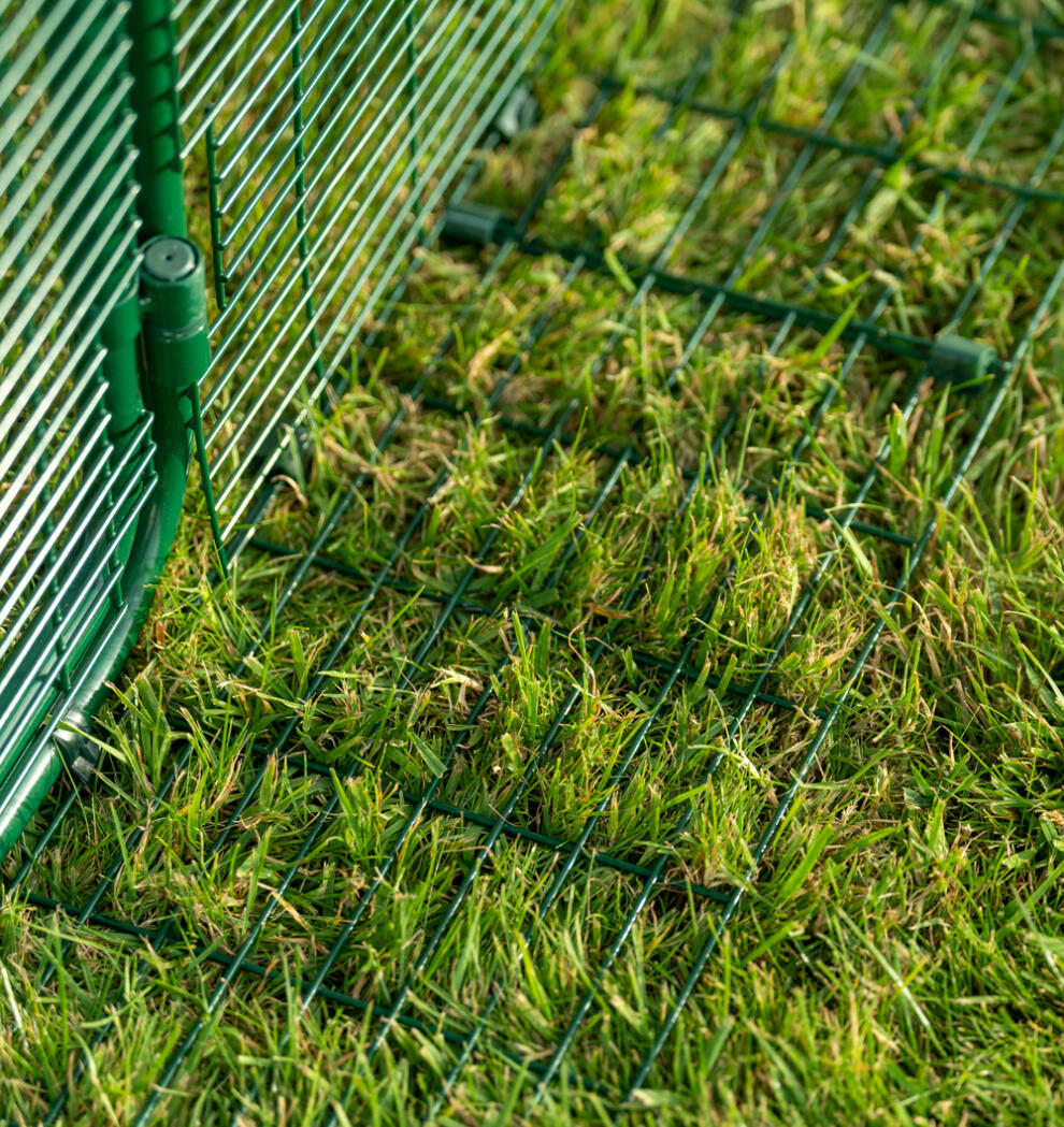 Close up of predator resistant anti tunnel skirting attached to Eglu Pro chicken coop run.