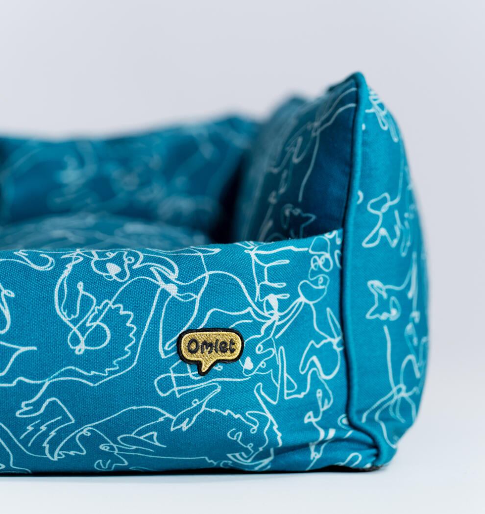 close up of Omlet Nest bed in the doodle dog print