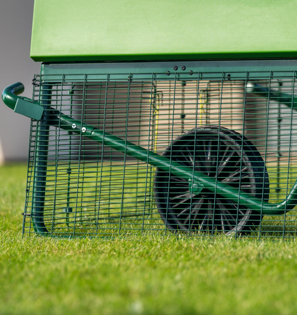 close up of the eglu pro large chicken coop run with wheels for easy manoeuvre