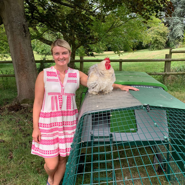 Claudia Audley behind Omlet Eglu Cube Chicken Coop